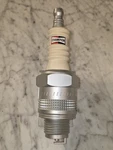 Champion Am/fm Spark Plug Transistor Radio. Fixed Price $125.00.
